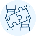 Two hands joining puzzle pieces
